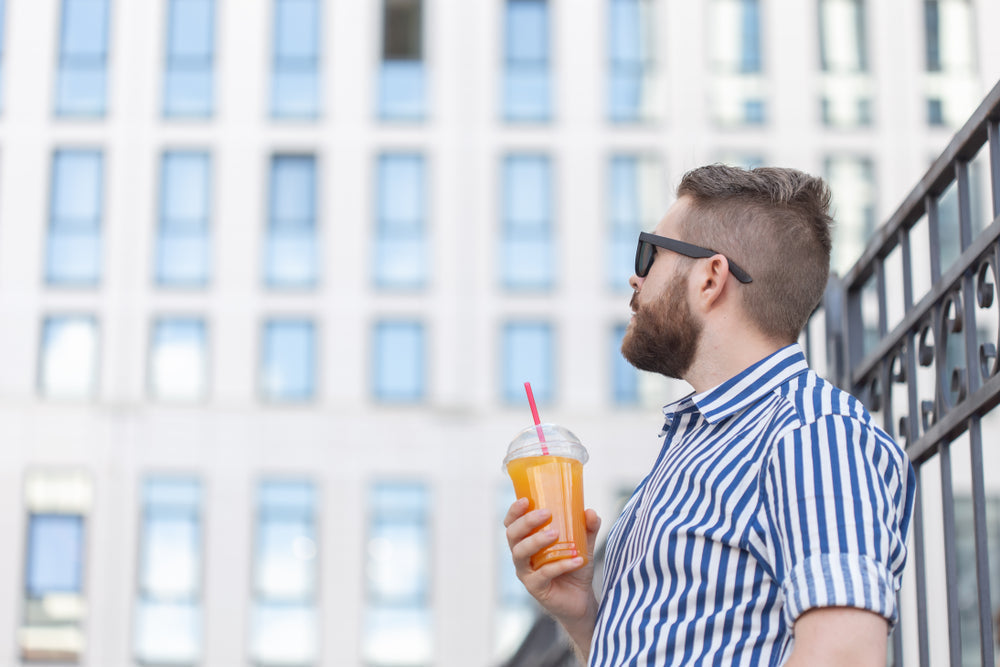 A calm moment with a glass of juice amid a busy modern life